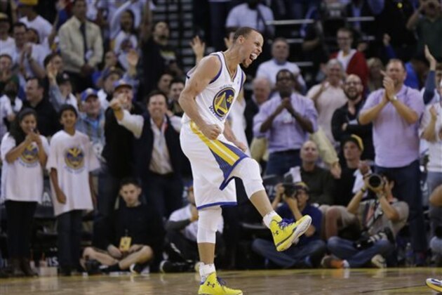 Golden State Warriors' Stephen Curry celebrates after scoring during the second half of an NBA basketball game against the Minnesota Timberwolves on Monday, April 14, 2014, in Oakland, Calif. Golden State won 130-120. (AP Photo/Marcio Jose Sanchez)