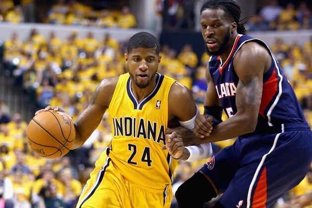 INDIANAPOLIS, IN - APRIL 19: Paul George #24 of the the Indiana Pacwrs drives to the basket against the Atlanta Hawks in Game 1 of the Eastern Conference Quarterfinals during the 2014 NBA Playoffs at Bankers Life Fieldhouse on April 19, 2014 in Indianapolis, Indiana. NOTE TO USER: User expressly acknowledges and agrees that, by downloading and or using this photograph, User is consenting to the terms and conditions of the Getty Images License Agreement.  (Photo by Andy Lyons/Getty Images)