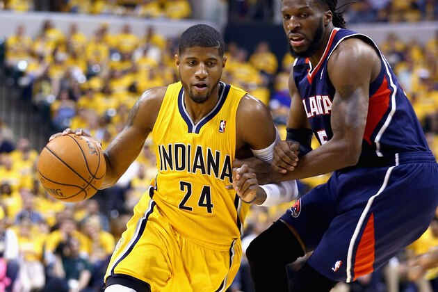 INDIANAPOLIS, IN - APRIL 19: Paul George #24 of the the Indiana Pacwrs drives to the basket against the Atlanta Hawks in Game 1 of the Eastern Conference Quarterfinals during the 2014 NBA Playoffs at Bankers Life Fieldhouse on April 19, 2014 in Indianapolis, Indiana. NOTE TO USER: User expressly acknowledges and agrees that, by downloading and or using this photograph, User is consenting to the terms and conditions of the Getty Images License Agreement.  (Photo by Andy Lyons/Getty Images)