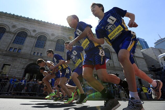 Middle school runners leave the starting line for the B.A.A. Invitational 1,000 meter run Saturday, April 19, 2014, in advance of Monday's 118th Boston Marathon in Boston. (AP Photo/Matt Rourke)