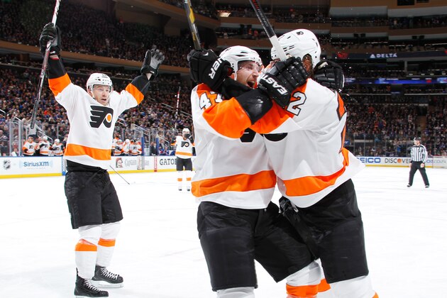 NEW YORK, NY - APRIL 20:  Luke Schenn #22, Michael Raffl #12 and Andrew MacDonald #47 of the Philadelphia Flyers celebrate after a second-period goal against the New York Rangers in Game Two of the First Round of the 2014 Stanley Cup Playoffs at Madison Square Garden on April 20, 2014 in New York City. (Photo by Scott Levy/NHLI via Getty Images)