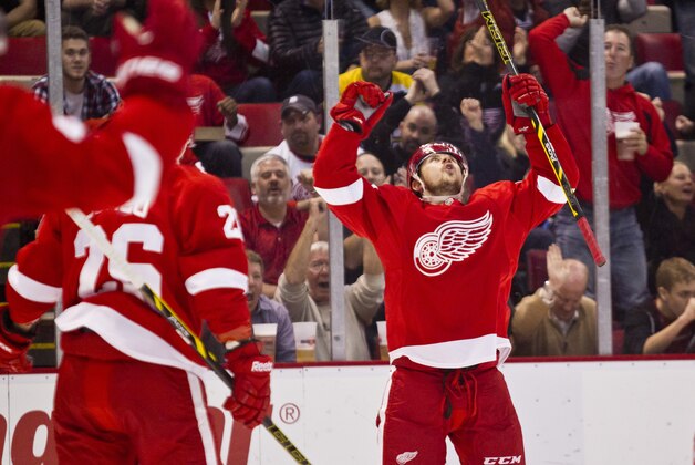 Detroit Red Wings forward Tomas Tatar celebrates his goal, during the second period of an NHL hockey game against the Boston Bruins in Detroit, Mich., Wednesday, April 2, 2014. (AP Photo/Tony Ding)