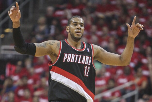 Apr 20, 2014; Houston, TX, USA; Portland Trail Blazers forward LaMarcus Aldridge (12) celebrates after scoring during the first quarter against the Houston Rockets in game one during the first round of the 2014 NBA Playoffs at Toyota Center. Mandatory Credit: Troy Taormina-USA TODAY Sports