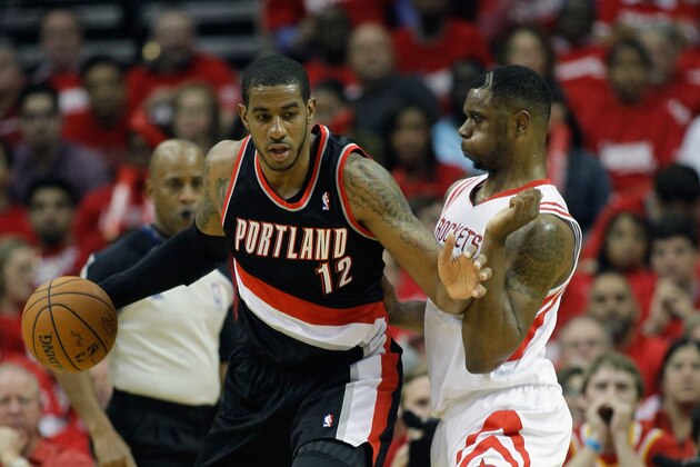 HOUSTON, TX - APRIL 20:  LaMarcus Aldridge #12 of the Portland Trail Blazers backs in on Terrence Jones #6 of the Houston Rockets in Game One of the Western Conference Quarterfinals during the 2014 NBA Playoffs at the Toyota Center on April 20, 2014 in Houston, Texas. NOTE TO USER: User expressly acknowledges and agrees that, by downloading and or using this photograph, User is consenting to the terms and conditions of the Getty Images License Agreement.  (Photo by Bob Levey/Getty Images)