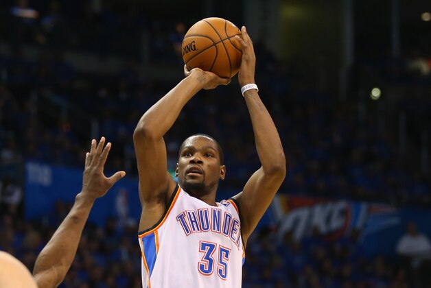 OKLAHOMA CITY, OK - APRIL 19:  Kevin Durant #35 of the Oklahoma City Thunder takes a shot in Game One of the Western Conference Quarterfinals during the 2014 NBA Playoffs at Chesapeake Energy Arena on April 19, 2014 in Oklahoma City, Oklahoma.  NOTE TO USER: User expressly acknowledges and agrees that, by downloading and or using this photograph, User is consenting to the terms and conditions of the Getty Images License Agreement.  (Photo by Ronald Martinez/Getty Images)