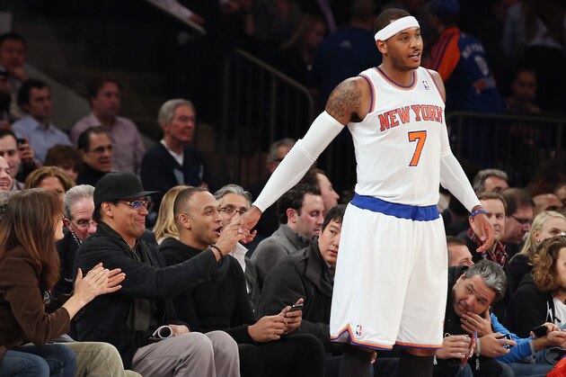 NEW YORK, NY - DECEMBER 11: Carmelo Anthony #7 of the New York Knicks shakes hands with actor Jimmy Smits at the start of the game against the Chicago Bulls at Madison Square Garden on December 11, 2013 in New York City. The Knicks defeated the Bulls 83-78. NOTE TO USER: User expressly acknowledges and agrees that, by downloading and or using this Photograph, user is consenting to the terms and conditions of the Getty Images License Agreement.  (Photo by Bruce Bennett/Getty Images)