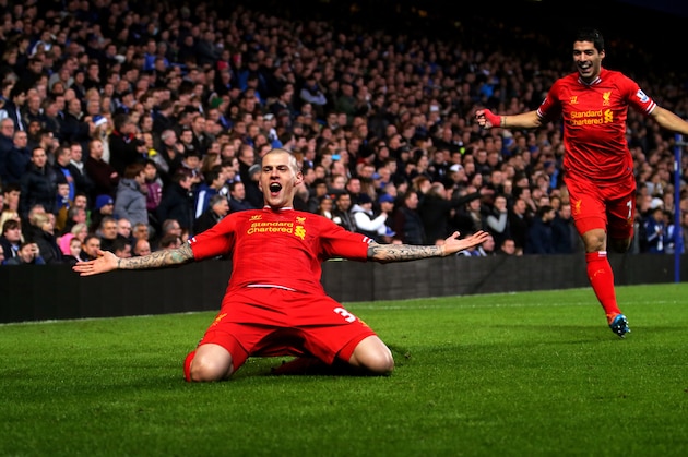 LONDON, ENGLAND - DECEMBER 29:  Martin Skrtel of Liverpool celebrates with teammate Luis Suarez (R) after scoring the opening goal during the Barclays Premier League match between Chelsea and Liverpool at Stamford Bridge on December 29, 2013 in London, England.  (Photo by Clive Rose/Getty Images)