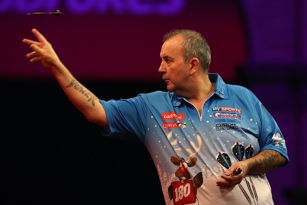 LONDON, ENGLAND - DECEMBER 13: Phil Taylor of England throws during his first round match against Rob Szabo of New Zealand during the Ladbrokes.com World Darts Championship on Day One at Alexandra Palace on December 13, 2013 in London, England. (Photo by Charlie Crowhurst/Getty Images) LONDON, ENGLAND - DECEMBER 13: Phil Taylor of England throws during his first round match against Rob Szabo of New Zealand during the Ladbrokes.com World Darts Championship on Day One at Alexandra Palace on December 13, 2013 in London, England. (Photo by Charlie Crowhurst/Getty Images)