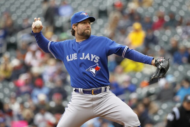 Toronto Blue Jays starting pitcher R.A. Dickey delivers to the Minnesota Twins during the first inning of the first baseball game of a doubleheader in Minneapolis, Thursday, April 17, 2014. (AP Photo/Ann Heisenfelt)