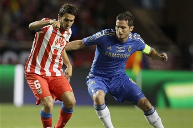Atletico Madrid midfielder Koke, left, challenges for the ball with Chelsea midfielder Frank Lampard during the UEFA Super Cup final soccer match between Chelsea and Atletico Madrid, at the Louis II stadium, in Monaco, Friday, Aug. 31, 2012. (AP Photo/Antonio Calanni)