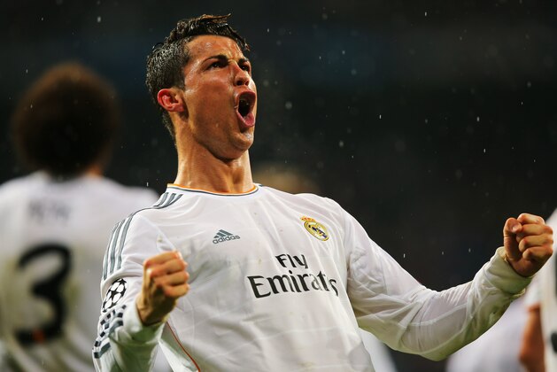 MADRID, SPAIN - APRIL 02:  Cristiano Ronaldo of Real Madrid celebrates scoring his goal during the UEFA Champions League Quarter Final first leg match between Real Madrid and Borussia Dortmund at Estadio Santiago Bernabeu on April 2, 2014 in Madrid, Spain.  (Photo by Clive Rose/Getty Images)
