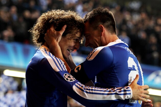 LONDON, ENGLAND - MARCH 14:  John Terry (R)of Chelsea celebrates with teammate David Luiz (L) after scoring his team's second goal during the UEFA Champions League round of 16 second leg match between Chelsea FC and SSC Napoli Stamford Bridge on March 14, 2012 in London, England.  (Photo by Clive Rose/Getty Images)