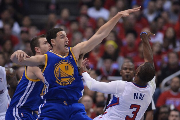 Apr 19, 2014; Los Angeles, CA, USA; Golden State Warriors guard Klay Thompson (11) guards Los Angeles Clippers guard Chris Paul (3) in the first quarter in game one during the first round of the 2014 NBA Playoffs at Staples Center. Mandatory Credit: Jayne Kamin-Oncea-USA TODAY Sports