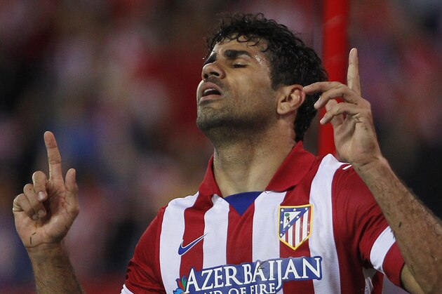Atletico's Diego Costa celebrates his goal during a Spanish La Liga soccer match between Atletico de Madrid and Elche at the Vicente Calderon stadium in Madrid, Spain, Friday, April 18, 2014. (AP Photo/Gabriel Pecot)