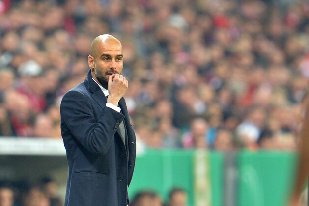 Munich head coach Pep Guardiola reacts during the German soccer cup, DFB Pokal, semifinal match between FC Bayern Munich and FC Kaiserslautern in the Allianz Arena in Munich, Germany, on Wednesday, April 16. 2014. (AP Photo/Kerstin Joensson)