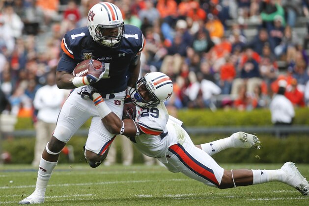 Auburn wide receiver Trovon Reed (1) is brought down by Auburn defensive back Brandon King (29) in the first half of the annual A Day spring intrasquad NCAA college football game on Saturday, April 19, 2014, in Auburn, Ala. (AP Photo/John Bazemore) Auburn wide receiver Trovon Reed (1) is brought down by Auburn defensive back Brandon King (29) in the first half of the annual A Day spring intrasquad NCAA college football game on Saturday, April 19, 2014, in Auburn, Ala. (AP Photo/John Bazemore)