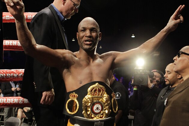 Bernard Hopkins, of the United States, leaves the ring after defeating Beibut Shumenov, of Kazakhstan, by a split decision after their IBF, WBA and IBA Light Heavyweight World Championship unification boxing match, Sunday, April 20, 2014, in Washington. Hopkins won by a split decision.  (AP Photo/Luis M. Alvarez)