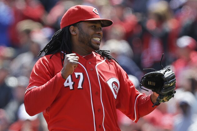 Cincinnati Reds starting pitcher Johnny Cueto reacts after throwing a complete game, three hit shutout, against the Pittsburgh Pirates in a baseball game, Wednesday, April 16, 2014, in Cincinnati. (AP Photo/Al Behrman)