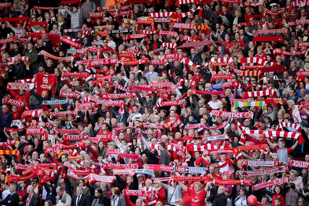 LIVERPOOL, ENGLAND - APRIL 15:  Liverpool fans sing 'You'll Never Walk Alone' during the Hillsborough memorial service marking the 25th anniversary of the Hillsborough Disaster at Anfield stadium on April 15, 2014 in Liverpool, England. Thousands of fans, friends and relatives took part in the service at Liverpool's Anfield stadium to mark the 25th anniversary of the Hillsborough disaster. Bells across the City of Liverpool rung during a one minute silence. A total of 96 Liverpool supporters lost their lives during a crush at an FA Cup semi final against Nottingham Forest at the Hillsborough football ground in Sheffield, South Yorkshire in 1989.  (Photo by Christopher Furlong/Getty Images)