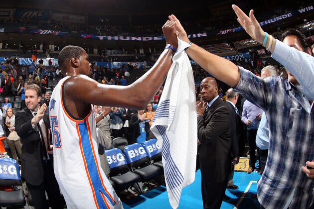 OKLAHOMA CITY, OK - JANUARY 17: Kevin Durant #35 of the Oklahoma City Thunder gets high fives from fans after an NBA game on January 17, 2014 at the Chesapeake Energy Arena in Oklahoma City, Oklahoma.  Durant had a career high of 54 points as the Thunder won 127-121. NOTE TO USER: User expressly acknowledges and agrees that, by downloading and or using this Photograph, user is consenting to the terms and conditions of the Getty Images License Agreement. Mandatory Copyright Notice: Copyright 2014 NBAE (Photo by Layne Murdoch/NBAE via Getty Images)