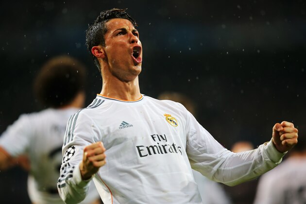 MADRID, SPAIN - APRIL 02:  Cristiano Ronaldo of Real Madrid celebrates scoring his goal during the UEFA Champions League Quarter Final first leg match between Real Madrid and Borussia Dortmund at Estadio Santiago Bernabeu on April 2, 2014 in Madrid, Spain.  (Photo by Clive Rose/Getty Images)