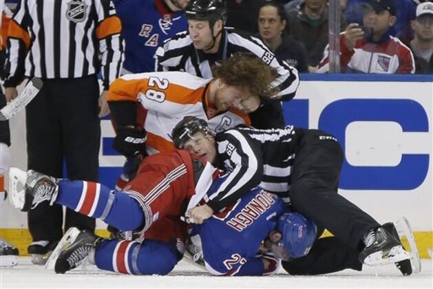 Linesmen Scott Driscoll (68) and Mark Shewchyk (92) wrestle New York Rangers defenseman Ryan McDonagh (27) and Philadelphia Flyers center Claude Giroux (28) from each other during a fight in the third period of Game 2 of the first round of the Stanley Cup hockey playoffs at Madison Square Garden in New York, Sunday, April 20, 2014.  The Flyers defeated the Rangers 4-2. (AP Photo/Kathy Willens)