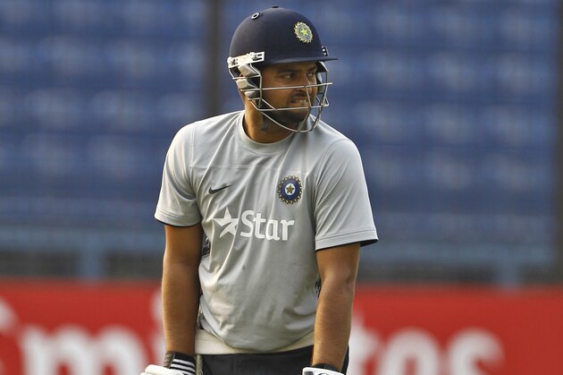 India's Suresh Raina stands next to the nets during a training session ahead of their ICC Twenty20 Cricket World Cup semi-final match against South Africa in Dhaka, Bangladesh, Wednesday, April 2, 2014. (AP Photo/A.M. Ahad)