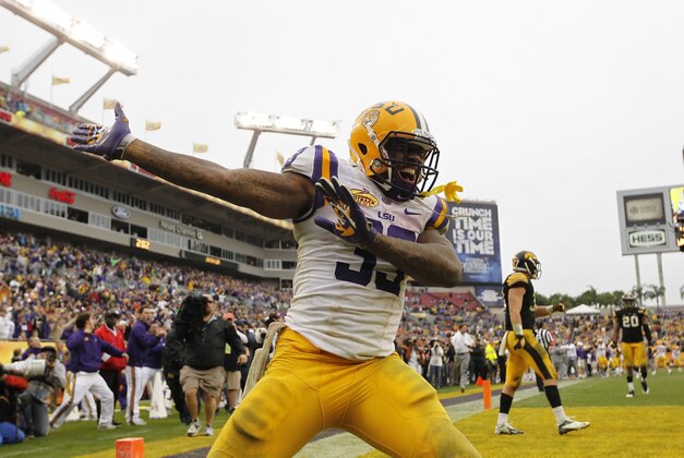 Jan 1, 2014; Tampa, Fl, USA; LSU Tigers running back Jeremy Hill (33) reacts and celebrates after he scored a touchdown against the Iowa Hawkeyes during the second half at Raymond James Stadium. LSU Tigers defeated the Iowa Hawkeyes 21-14. Mandatory Credit: Kim Klement-USA TODAY Sports