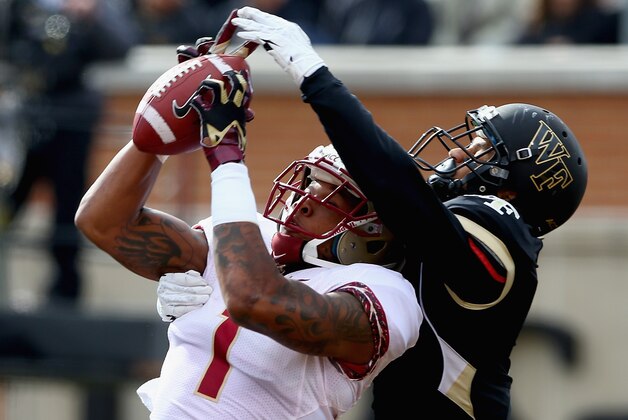 WINSTON SALEM, NC - NOVEMBER 09:  Kelvin Benjamin #1 of the Florida State Seminoles catches a touchdown against Kevin Johnson #9 of the Wake Forest Demon Deacons during their game at BB&T Field on November 9, 2013 in Winston Salem, North Carolina.  (Photo by Streeter Lecka/Getty Images)