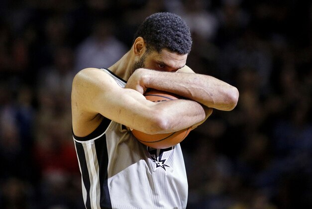 Apr 6, 2014; San Antonio, TX, USA; San Antonio Spurs forward Tim Duncan (21) clutches the ball prior to the game against the Memphis Grizzlies at AT&T Center. Mandatory Credit: Soobum Im-USA TODAY Sports