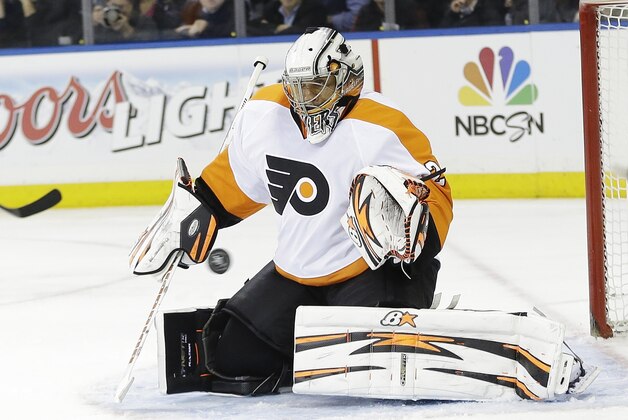Philadelphia Flyers goalie Ray Emery stops a shot on goal during the second period against the New York Rangers in Game 1 of an NHL hockey first-round playoff series on Thursday, April 17, 2014, in New York. (AP Photo/Frank Franklin II)