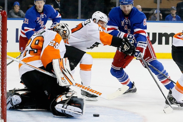 NEW YORK, NY - APRIL 20:  Rick Nash #61 of the New York Rangers shoots the puck as goalie Ray Emery #29 of the Philadelphia Flyers makes the stop in Game Two of the First Round of the 2014 NHL Stanley Cup Playoffs at Madison Square Garden on April 20, 2014 in New York City. The Flyers won 4-2.  (Photo by Paul Bereswill/Getty Images)