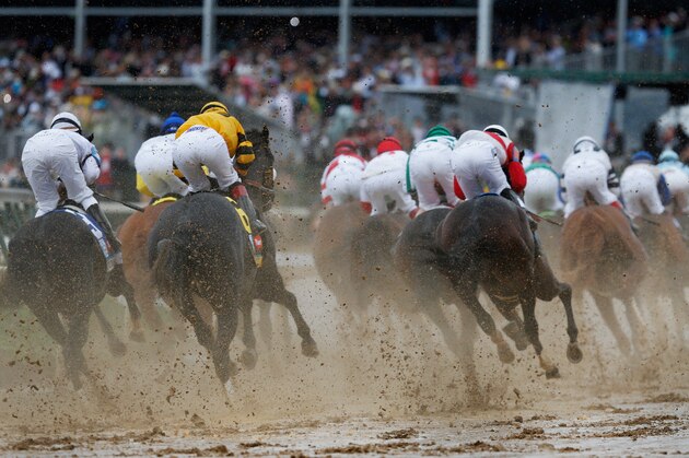 LOUISVILLE, KY - MAY 04: The field heads into the first turn during the 139th running of the Kentucky Derby at  Churchill Downs on May 4, 2013 in Louisville, Kentucky.  (Photo by Rob Carr/Getty Images)