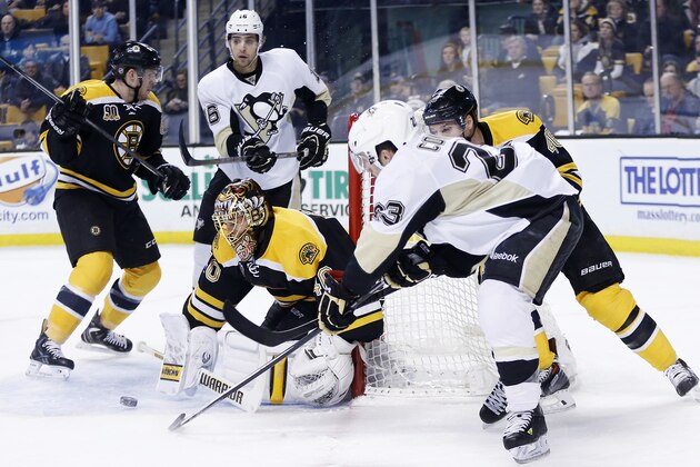 Boston Bruins goalie Tuukka Rask (40) blocks a shot by Pittsburgh Penguins' Chris Conner (23) in the first period of an NHL hockey game in Boston, Saturday, Dec. 7, 2013. (AP Photo/Michael Dwyer)