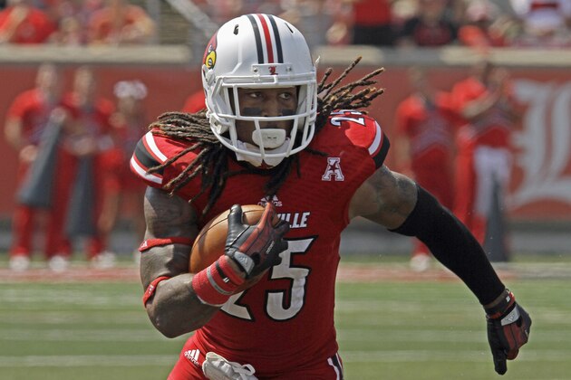 Louisville's Calvin Pryor turns and runs after picking off a pass against Eastern Kentucky in their NCAA college football game in Louisville, Ky., Saturday, Sept. 7, 2013. Louisville beat Eastern Kentucky 44-7.  (AP Photo/Garry Jones)