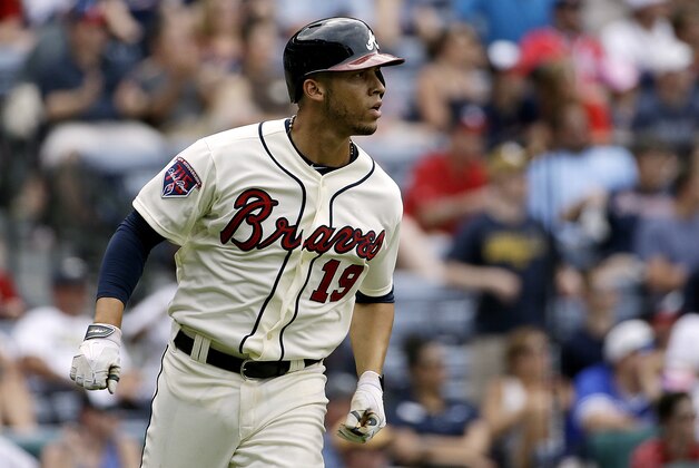 Atlanta Braves' Andrelton Simmons rounds first base after hitting a three-run home run in the eighth inning of a baseball game against the Washington Nationals, Sunday, April 13, 2014, in Atlanta. The Braves won 10-2. (AP Photo/David Goldman)
