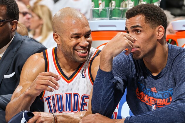 OKLAHOMA CITY, OK - MAY 7: Derek Fisher #6 of the Oklahoma City Thunder smiles on the bench while talking to teammate Thabo Sefolosha #2 as the team plays against the Memphis Grizzlies in Game Two of the Western Conference Semifinals during the 2013 NBA Playoffs on May 7, 2013 at the Chesapeake Energy Arena in Oklahoma City, Oklahoma. NOTE TO USER: User expressly acknowledges and agrees that, by downloading and or using this photograph, User is consenting to the terms and conditions of the Getty Images License Agreement. Mandatory Copyright Notice: Copyright 2013 NBAE (Photo by Layne Murdoch/NBAE via Getty Images)