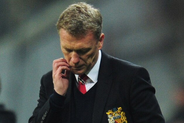 MUNICH, GERMANY - APRIL 09:  David Moyes, manager of Manchester United looks dejected during the UEFA Champions League Quarter Final second leg match between FC Bayern Muenchen and Manchester United at Allianz Arena on April 9, 2014 in Munich, Germany.  (Photo by Shaun Botterill/Getty Images)