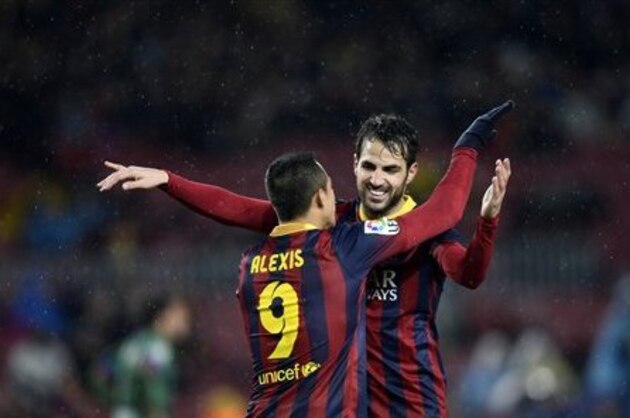 CORRECTS THE NAME OF BARCELONA'S OPPONENTS  FC Barcelona's Cesc Fabregas, right, celebrates with his teammate Alexis Sanchez, from Chile, after scoring against Levante during a Copa del Rey soccer match at the Camp Nou stadium in Barcelona, Spain, Wednesday, Jan. 29, 2014. (AP Photo/Manu Fernandez)