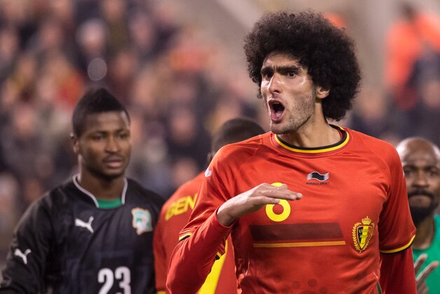 Belgium's Marouane Fellaini reacts during a friendly soccer match against Ivory Coast at the King Baudouin stadium in Brussels on Wednesday March 5, 2014. (AP Photo/Geert Vanden Wijngaert)