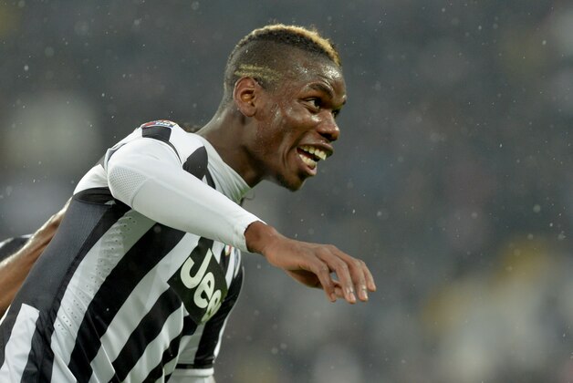 Juventus midfielder Paul Pogba, of France, celebrates after scoring during a Serie A soccer match between Juventus and Bologna at the Juventus stadium, in Turin, Italy, Saturday, April 19, 2014. (AP Photo/Massimo Pinca)