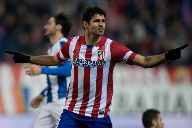MADRID, SPAIN - MARCH 15:  Diego Costa of Atletico de Madrid celebrates scoring their opening goal during the La Liga match between Club Atletico de Madrid and RCD Espanyol at Vicente Calderon Stadium on March 15, 2014 in Madrid, Spain.  (Photo by Gonzalo Arroyo Moreno/Getty Images)