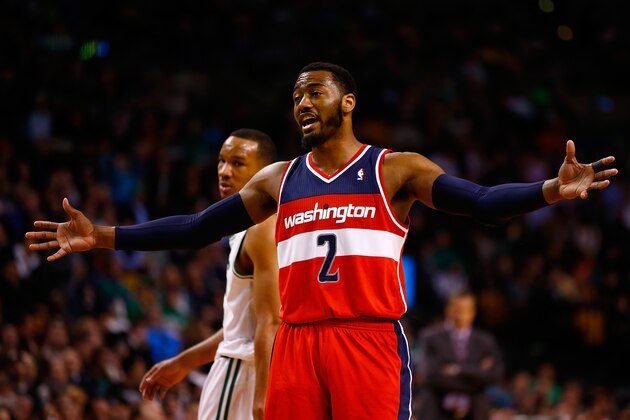 BOSTON, MA - APRIL 16:  John Wall #2 of the Washington Wizards talks to his teammates against the Boston Celtics in the second half during the game at TD Garden on April 16, 2014 in Boston, Massachusetts. NOTE TO USER: User expressly acknowledges and agrees that, by downloading and or using this photograph, User is consenting to the terms and conditions of the Getty Images License Agreement.  (Photo by Jared Wickerham/Getty Images)