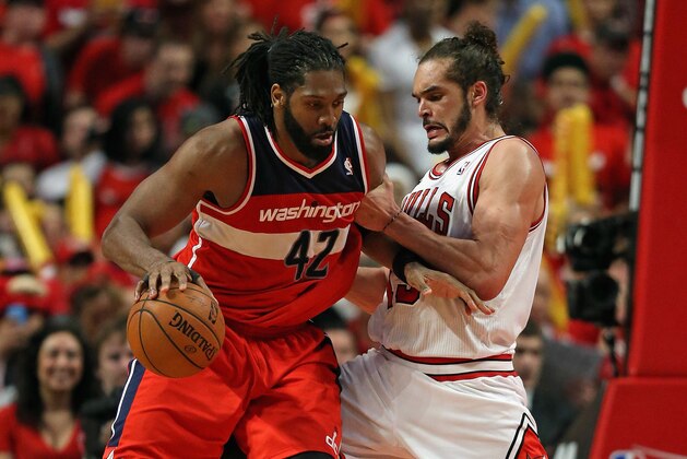 CHICAGO, IL - APRIL 20: Nene #42 of the Washington Wizards moves against Joakim Noah #13 of the Chicago Bulls in Game One of the Eastern Conference Quarterfinals during the 2014 NBA Playoffs at the United Center on April 20, 2014 in Chicago, Illinois. The Wizards defeated the Bulls 102-93. NOTE TO USER: User expressly acknowledges and agrees that, by downloading and or using this photograph, User is consenting to the terms and conditions of the Getty Images License Agreement.  (Photo by Jonathan Daniel/Getty Images)