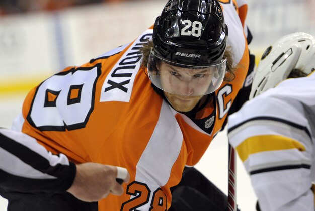 Apr 6, 2014; Philadelphia, PA, USA; Philadelphia Flyers center Claude Giroux (28) faces off against the Buffalo Sabres during the third period at Wells Fargo Center. The Flyers defeated the Sabres, 5-2. Mandatory Credit: Eric Hartline-USA TODAY Sports