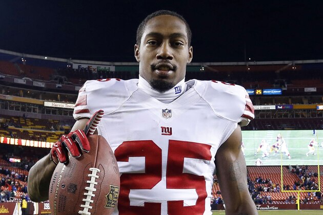 Dec 1, 2013; Landover, MD, USA;  New York Giants free safety Will Hill (25) holds the ball while leaving the field after the Giants game against the Washington Redskins at FedEx Field. The Giants won 24-17. Mandatory Credit: Geoff Burke-USA TODAY Sports