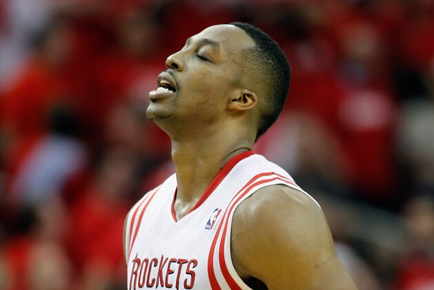 HOUSTON, TX - APRIL 20:  Dwight Howard #12 of the Houston Rockets during game action against the Portland Trail Blazers in Game One of the Western Conference Quarterfinals during the 2014 NBA Playoffs at the Toyota Center on April 20, 2014 in Houston, Texas. NOTE TO USER: User expressly acknowledges and agrees that, by downloading and or using this photograph, User is consenting to the terms and conditions of the Getty Images License Agreement.  (Photo by Bob Levey/Getty Images)