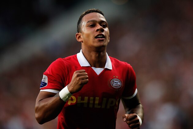 EINDHOVEN, NETHERLANDS - AUGUST 17:  Memphis Depay of PSV celebrates scoring the third goal of the game during the Eredivisie match between PSV Eindhoven and Go Ahead Eagles at Philips Stadion on August 17, 2013 in Eindhoven, Netherlands.  (Photo by Dean Mouhtaropoulos/Getty Images)
