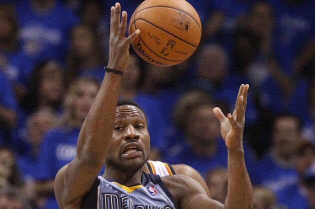Memphis Grizzlies guard Tony Allen (9) jumps up to grab a pass intended for Oklahoma City Thunder forward Kevin Durant, rear, in the first quarter of Game 2 of an opening-round NBA basketball playoff series in Oklahoma City, Monday, April 21, 2014. (AP Photo/Sue Ogrocki)