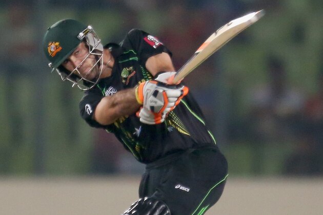 DHAKA, BANGLADESH - MARCH 30: Glenn Maxwell of Australia hits a six as MS Dhoni of India looks on during the ICC World Twenty20 Bangladesh 2014 match between India v Australia at Sher-e-Bangla Mirpur Stadium on March 30, 2014 in Dhaka, Bangladesh. (Photo by Scott Barbour/Getty Images) DHAKA, BANGLADESH - MARCH 30: Glenn Maxwell of Australia hits a six as MS Dhoni of India looks on during the ICC World Twenty20 Bangladesh 2014 match between India v Australia at Sher-e-Bangla Mirpur Stadium on March 30, 2014 in Dhaka, Bangladesh. (Photo by Scott Barbour/Getty Images)